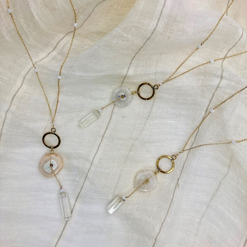 solar quartz and crystal y necklaces