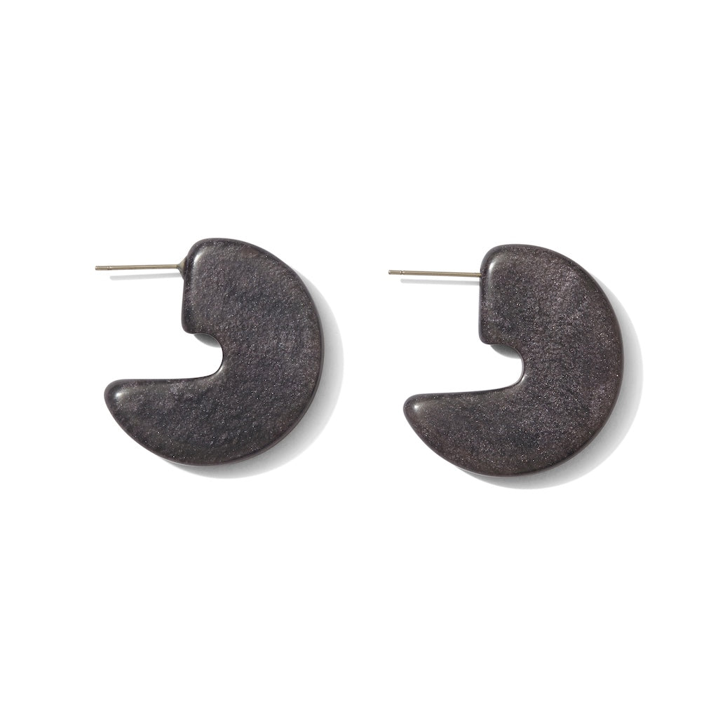 Pair of dark gray half-circle earrings on a white background