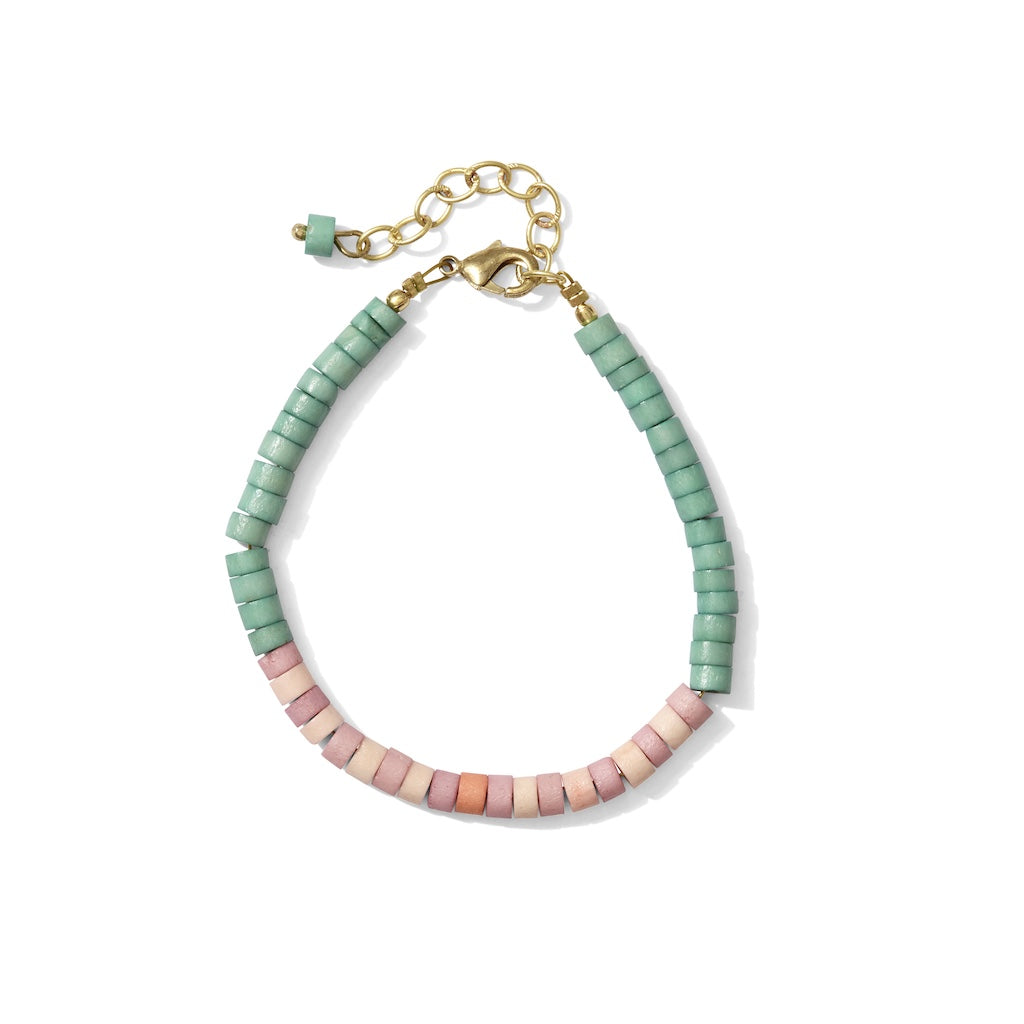 Bracelet with green and pink beads on a white background