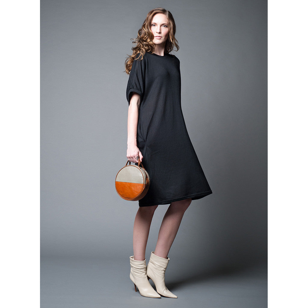 model with round moon clutch